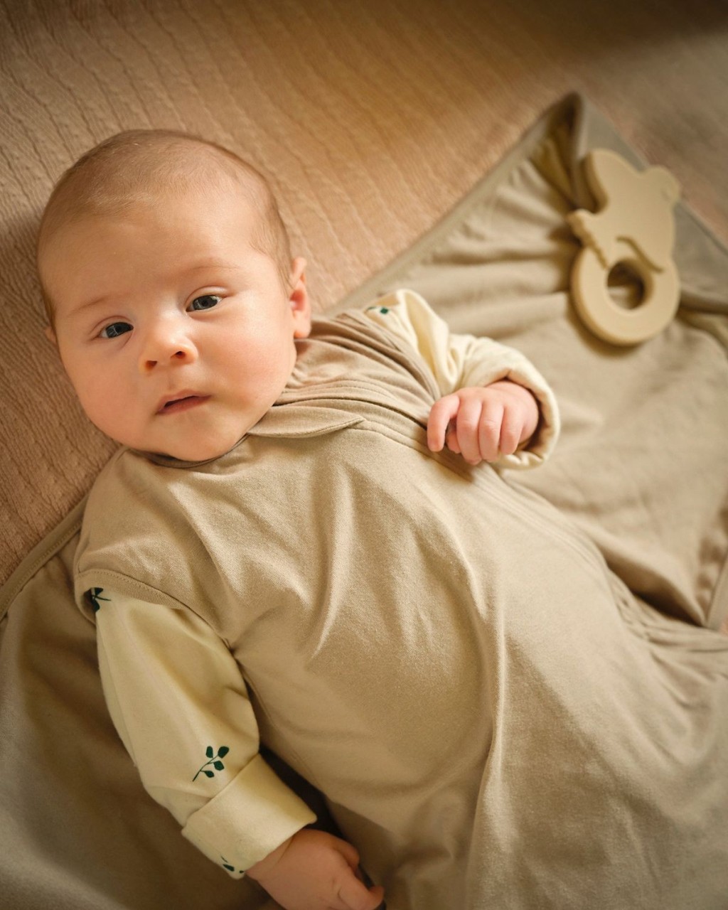 baby, onesie, beige, long-sleeve, laying